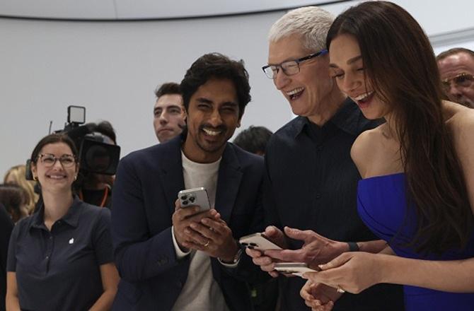 Aditi Rao Hydari and Siddharth with Apple CEO Tim Cook at the launch of the new iPhone. Photo: PTI