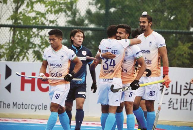 Indian hockey players are seen after winning the match. Photo: INN