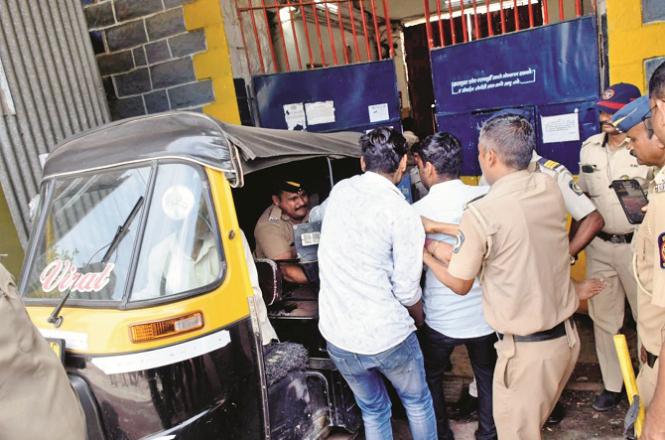 Injured prisoner Sachin (not visible) being loaded into a police rickshaw. Photo: INN