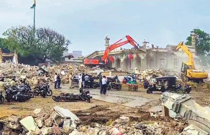 A scene of bulldozer action on the ancient mosque behind the Somnath temple. Photo: PTI