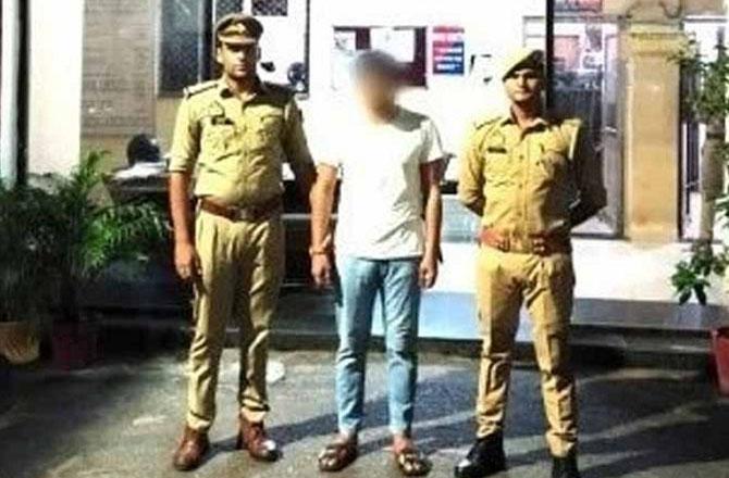 The accused can be seen in police custody. Photo: INN