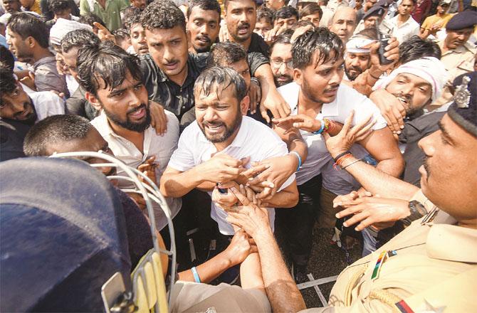 Young Congress leader Kanhaiya Kumar being forcibly stopped by the police from reaching Nitish Kumar`s residence. Photo: PTI