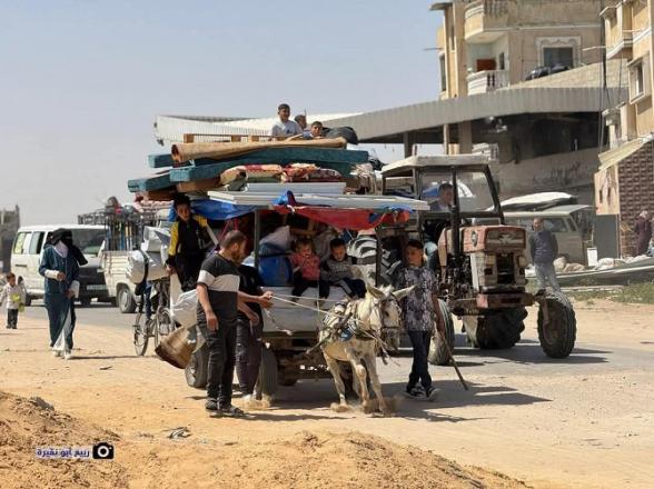 Palestinians can be seen riding a donkey cart. Photo: X
