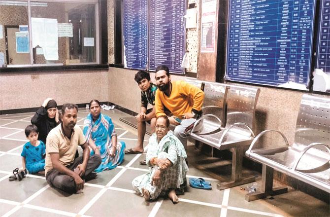 Santosh Kumar Goud and other passengers spending the night in the booking hall of Vikhroli railway station.