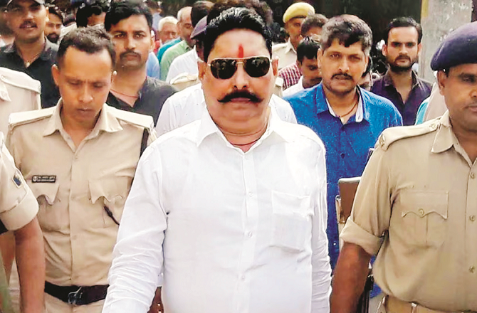Bihar`s prominent leader Anant Singh with security personnel. Photo: INN