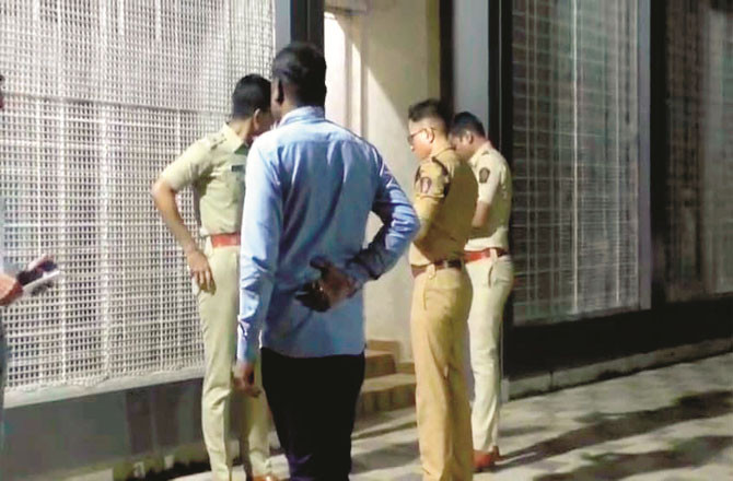 Police officers inspecting the scene of the crime.