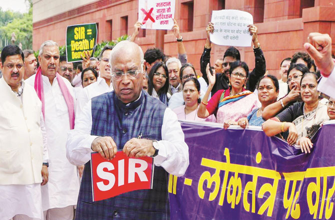 The opposition is protesting vigorously, with Kharge tearing up the `SIR`.