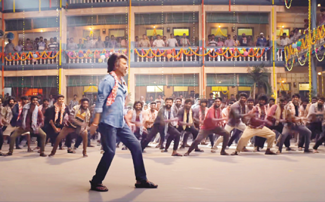 Superstar Rajinikanth dancing in his unique style in a scene from the Tamil film "Coolie". Photo: INN