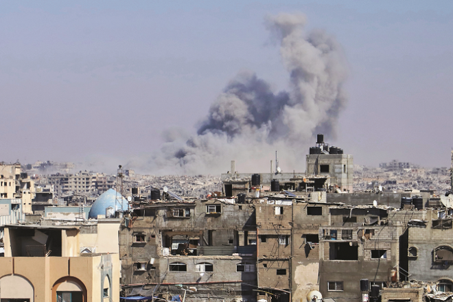 Smoke rises from an area in a photo taken after an Israeli airstrike in Khan Younis on Thursday. Photo: INN