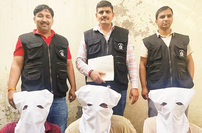 The three accused are seen in police custody. Photo: INN