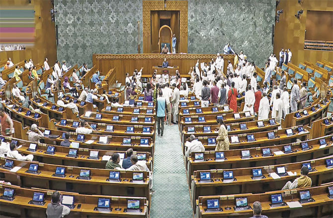 Opposition members protest in both houses of the Lok Sabha. (PTI)