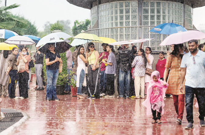 Rainy scene in the Connaught Palace area of the national capital Delhi. (PTI)