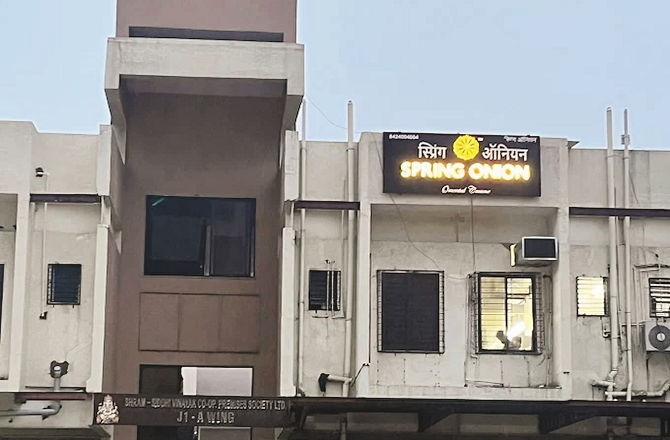 This restaurant is on the first floor of the building, so only its board can be seen. Photo: INN