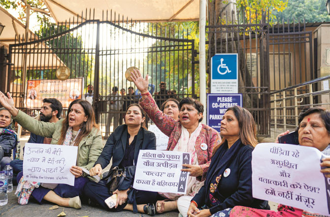 Social activists protest at the gate of the Delhi High Court on Friday against the court`s relief to Kuldeep Sengar. (PTI)