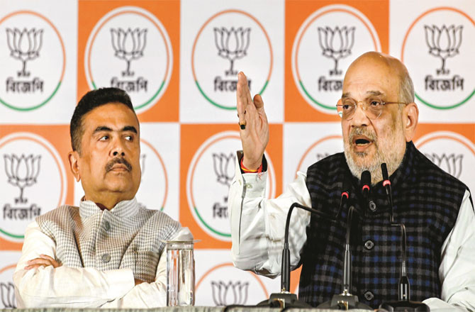 Amit Shah was accompanied by Shobhindu Adhikari at the press conference (Photo: PTI)