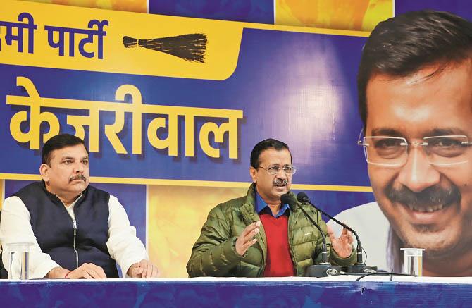 Arvind Kejriwal and Sanjay Singh during the press conference. Photo: PTI