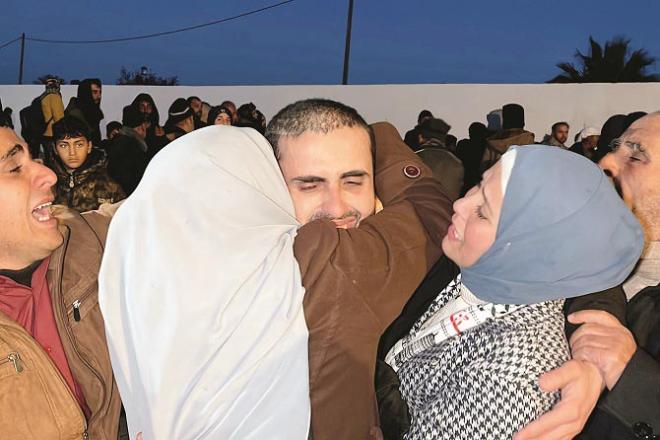 An emotional scene of a prisoner meeting his family. Photo: INN