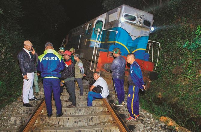 Police and others on the railway track after the accident. Photo: INN.