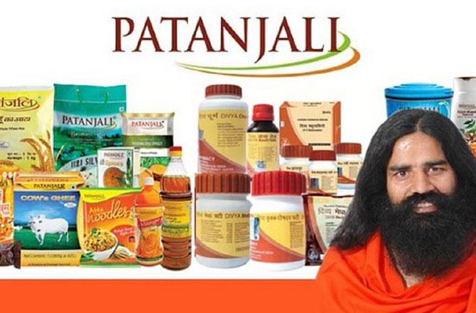Baba Ramdev with his company`s products. Photo: INN