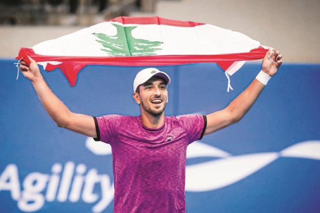 Lebanese player Hadi Habib waving the national flag. Photo: INN