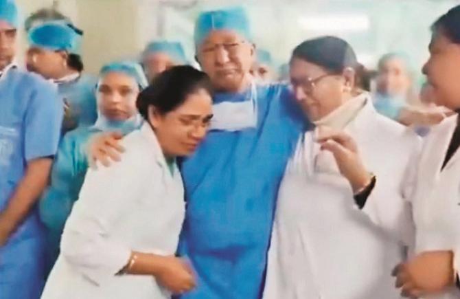 Dr. Jeevan Titiyal cries while meeting fellow doctors. Photo: INN