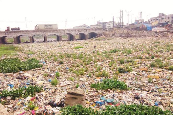 Due to illegal constructions and garbage dumping, the Kamwari river looks like a drain. Photo: INN