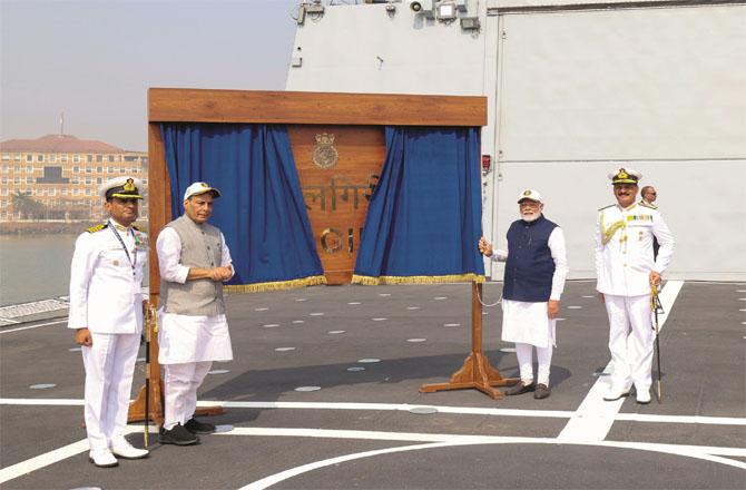 Prime Minister Modi and Defense Minister Rajnath Singh dedicating warships to the nation.