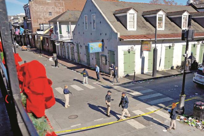 Officials from the FBI and other investigative agencies can be seen gathering evidence at the crime scene. Photo: INN