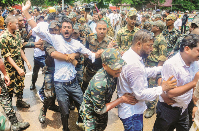Scene of protest by BJD and other organizations outside the Odisha Assembly. (PTI)