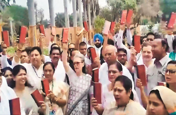 Opposition leaders showing copies of the Constitution