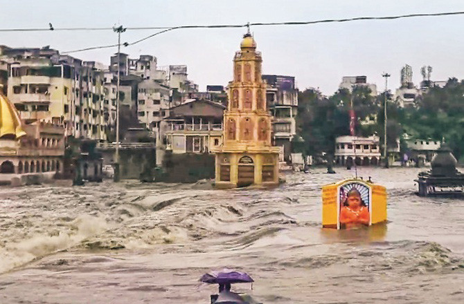 Heavy rains in Nashik and surrounding areas have caused the water level of the Godavari river to rise. Photo: PTI