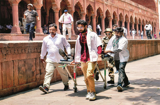 Medical and CISF personnel during a mock drill to save people from heat in Agra. (PTI)