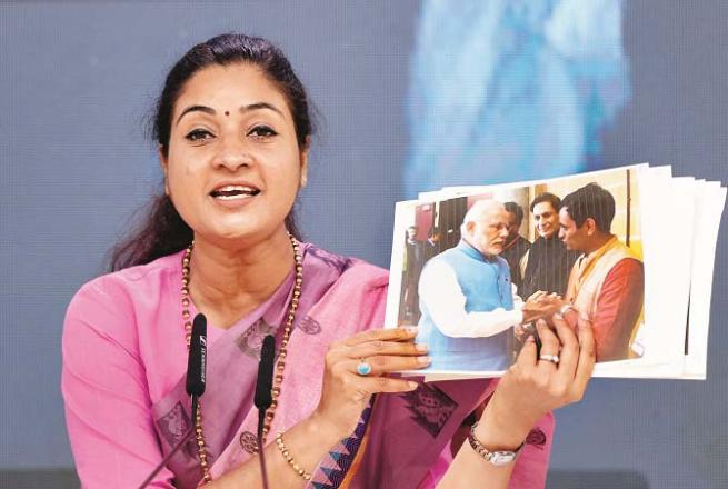 Alka Lamba showed the media pictures of Balesh Dhankar with Narendra Modi. Photo: PTI