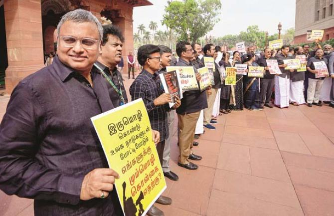 Along with DMK, members of Congress and other parties are also seen wearing black. Photo: INN
