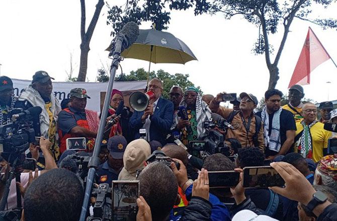 Ibrahim Rasool speaking through a megaphone. Photo: X
