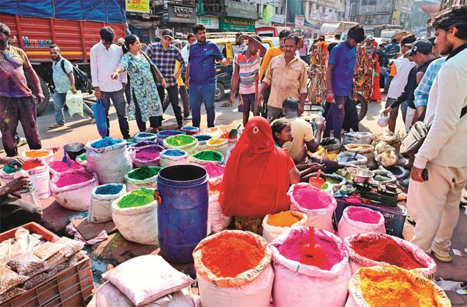 People are buying colors for Holi in the Masjidbandar area. 