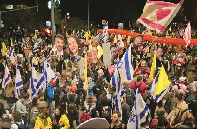 Israeli protesters protest against Netanyahu`s war policy in Tel Aviv`s busiest square