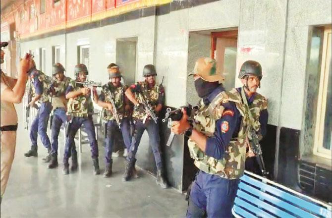 Security personnel can be seen during a mock drill at Nanded Rewale station