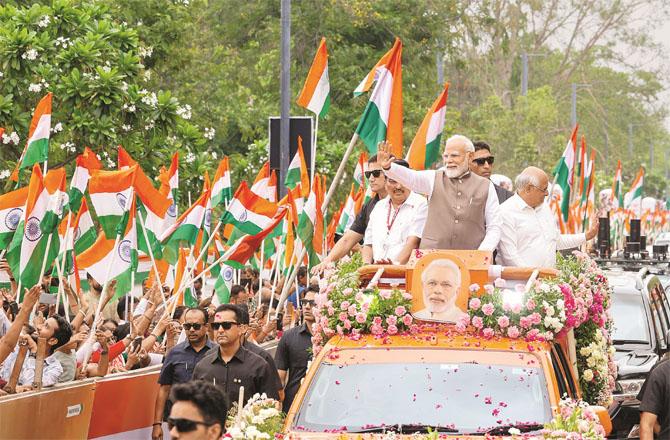 Prime Minister Modi during a road show in Gandhinagar