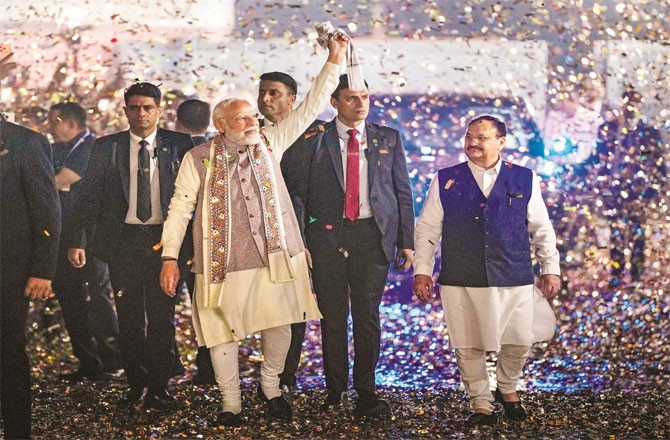 Prime Minister Modi celebrates with other leaders at the party headquarters after the surprise victory in Bihar. (Photo: PTI)