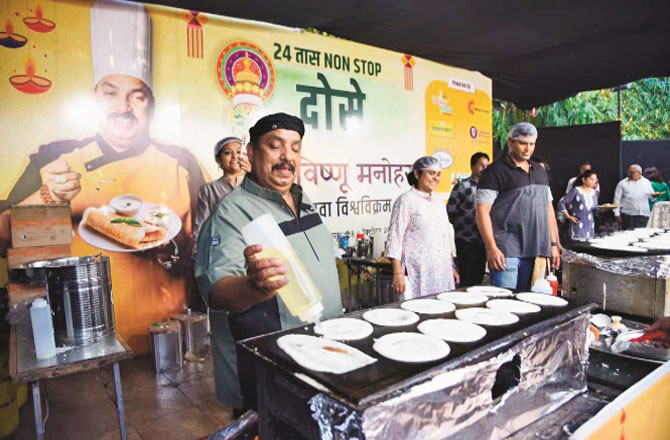 Vishnu Manohar can be seen preparing dosa at Gunavant Lawn in Amaravati.