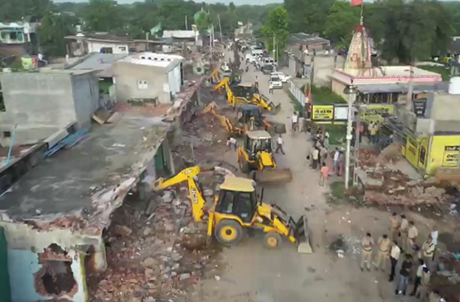 Bulldozers were driven over minority properties in the name of illegal construction in Bahiyal village of Gandhinagar. Photo: X