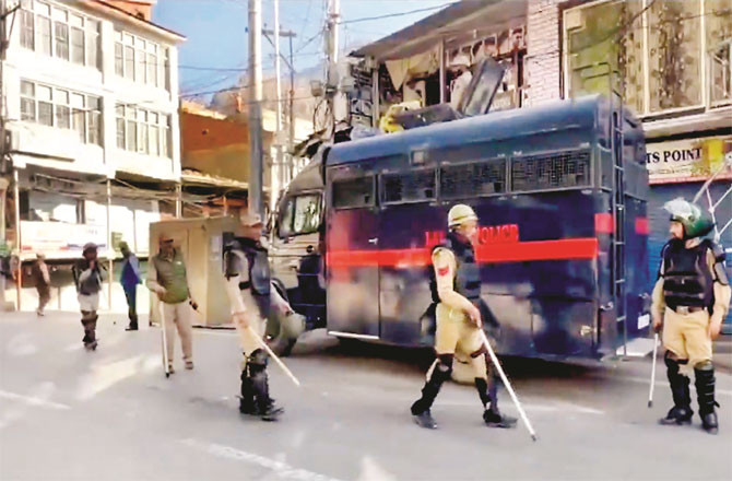 A strict curfew has been imposed in Leh following the violence. (Inset: Environmental activist Sonam Wangchuk) (Photos: PTI)