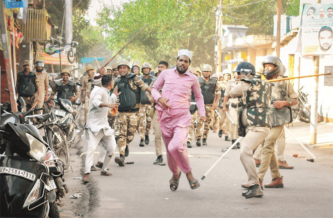 Police lathi-charged local Muslims during a protest in Bareilly. (Inset: Maulana Tauqir Raza Khan). (Photo: PTI)