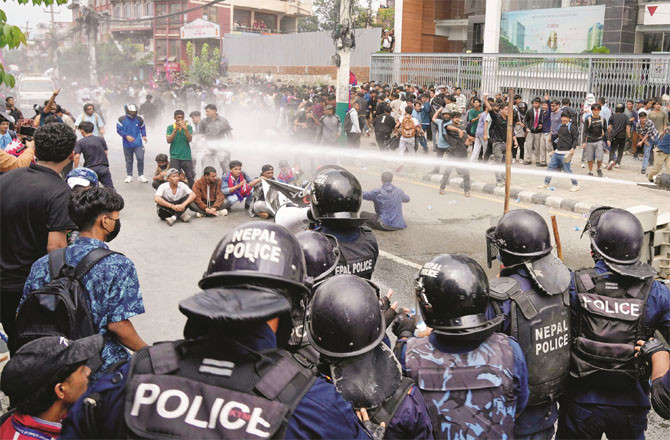 Police try to stop protesters outside Nepal`s parliament. (Photo: PTI)