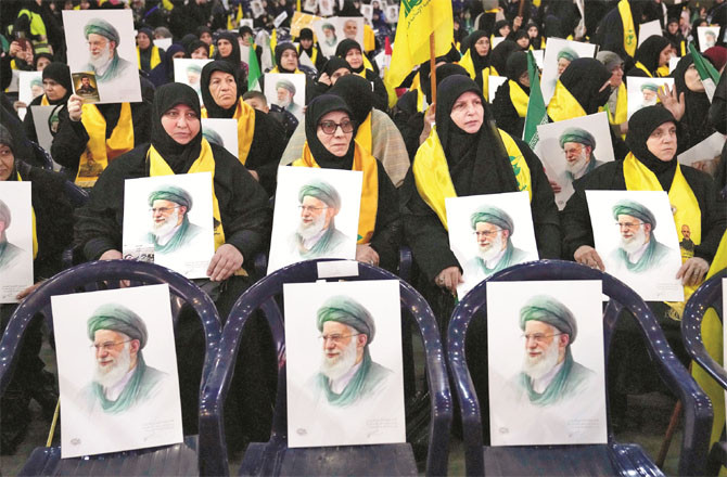 With a picture of Supreme Leader Ayatollah Ali Khamenei, a supporter of Hezbollah, in Beirut. (AP/PTI)