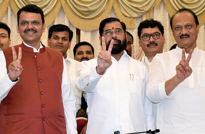 Ajit Pawar, Eknath Shinde and Devendra Fadnavis showing victory sign. Photo: INN