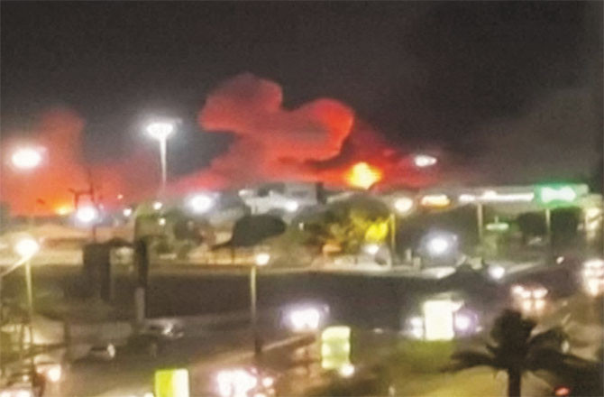 In a still taken from the video, clouds of smoke can be seen rising from the Iranian coastal city of Bandar Abbas.