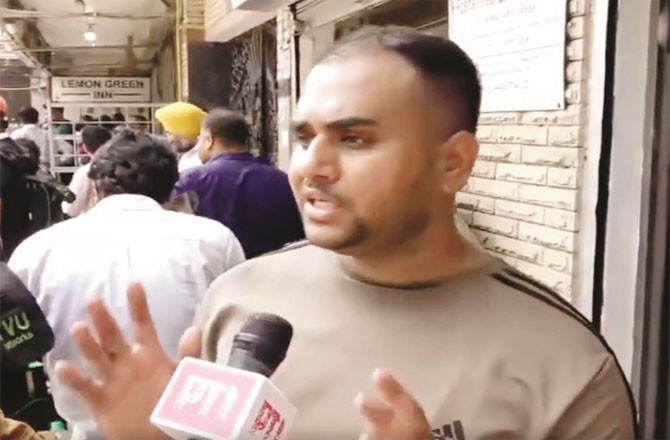 Mattress vendor Muhammad Arman talking to the media.