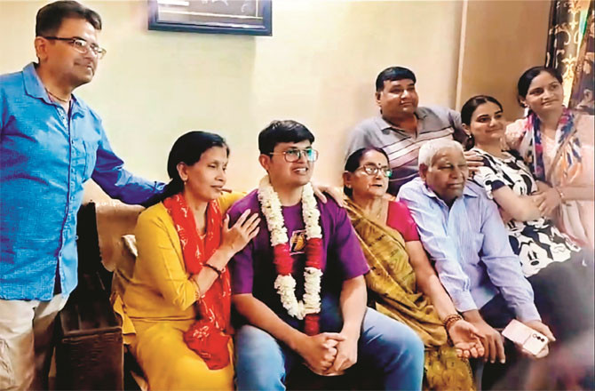 Anuj Agnihotri, who secured first position in UPSC exam-25, with his family.